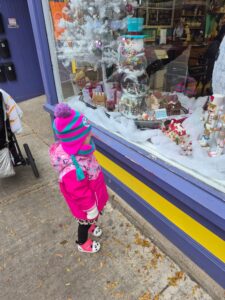 My daughter looking in a Christmas window
