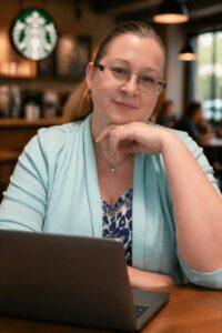 laptop with light blue cardigan