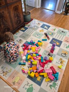 Daughter playing on mat